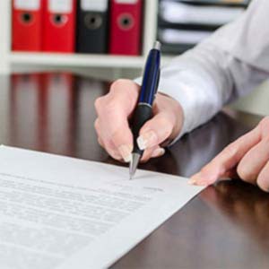 man writing a formal letter