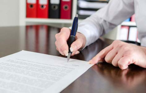 man writing a formal letter