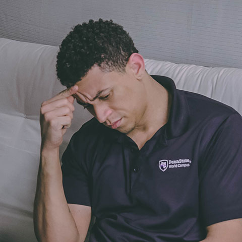 a person searching on web and taking notes